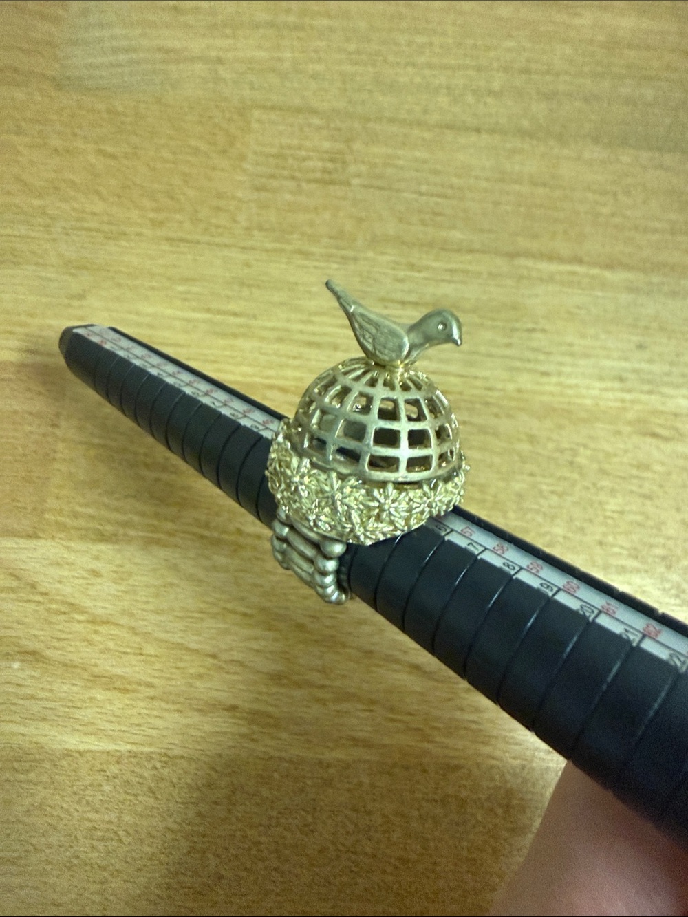 Bird on birdcage adjustable gold tone ring